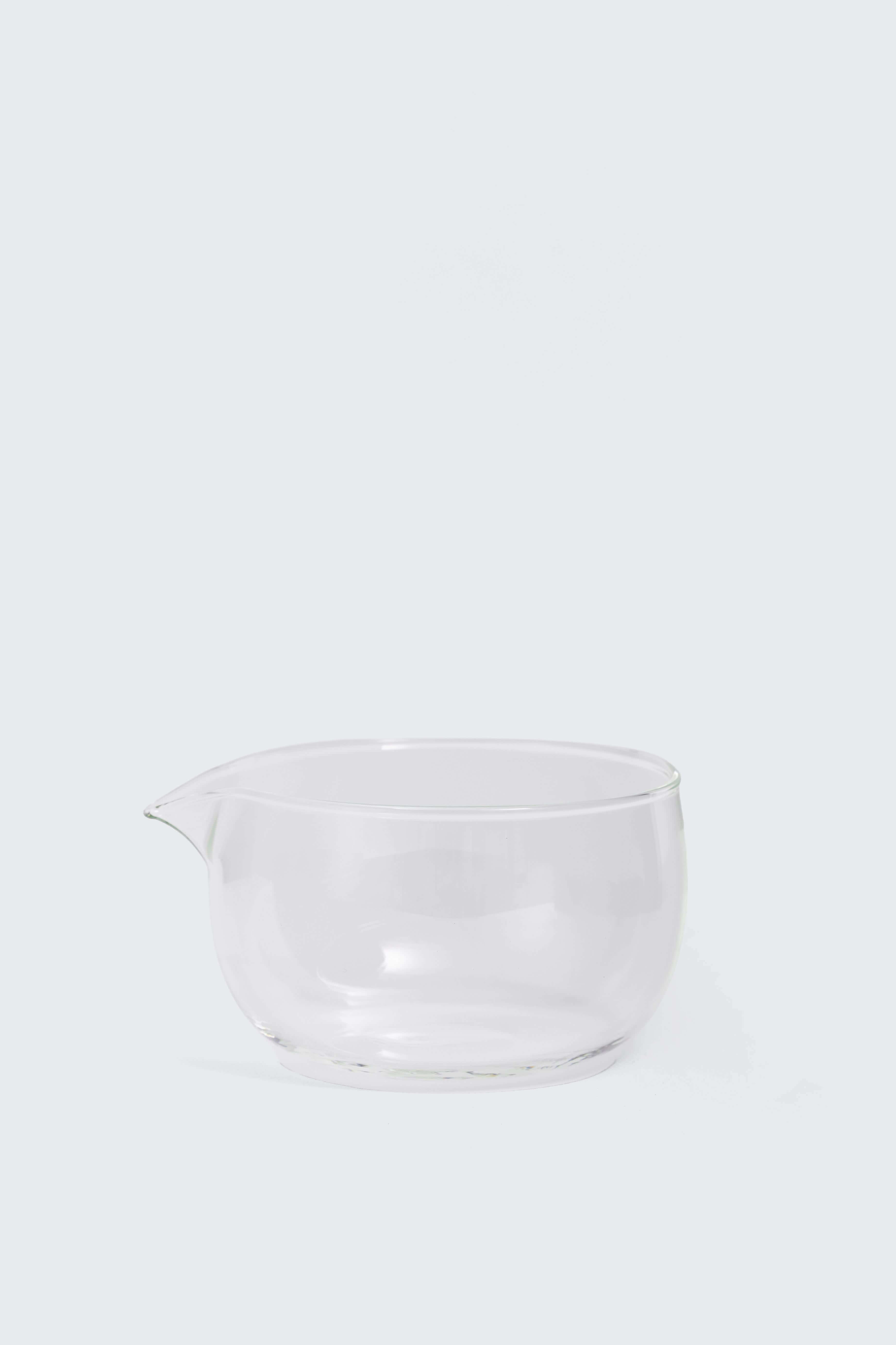 Clear glass matcha bowl for mixing by Matcha Ready, with a smooth curved shape and wide open top for easy whisking.