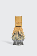 Dark gray bamboo matcha whisk holder from Matcha Ready, designed to hold and display matcha whisks securely.
