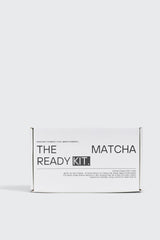 Matcha Ready kit featuring a vibrant green matcha powder, bamboo whisk, and traditional accessories for preparing matcha tea.