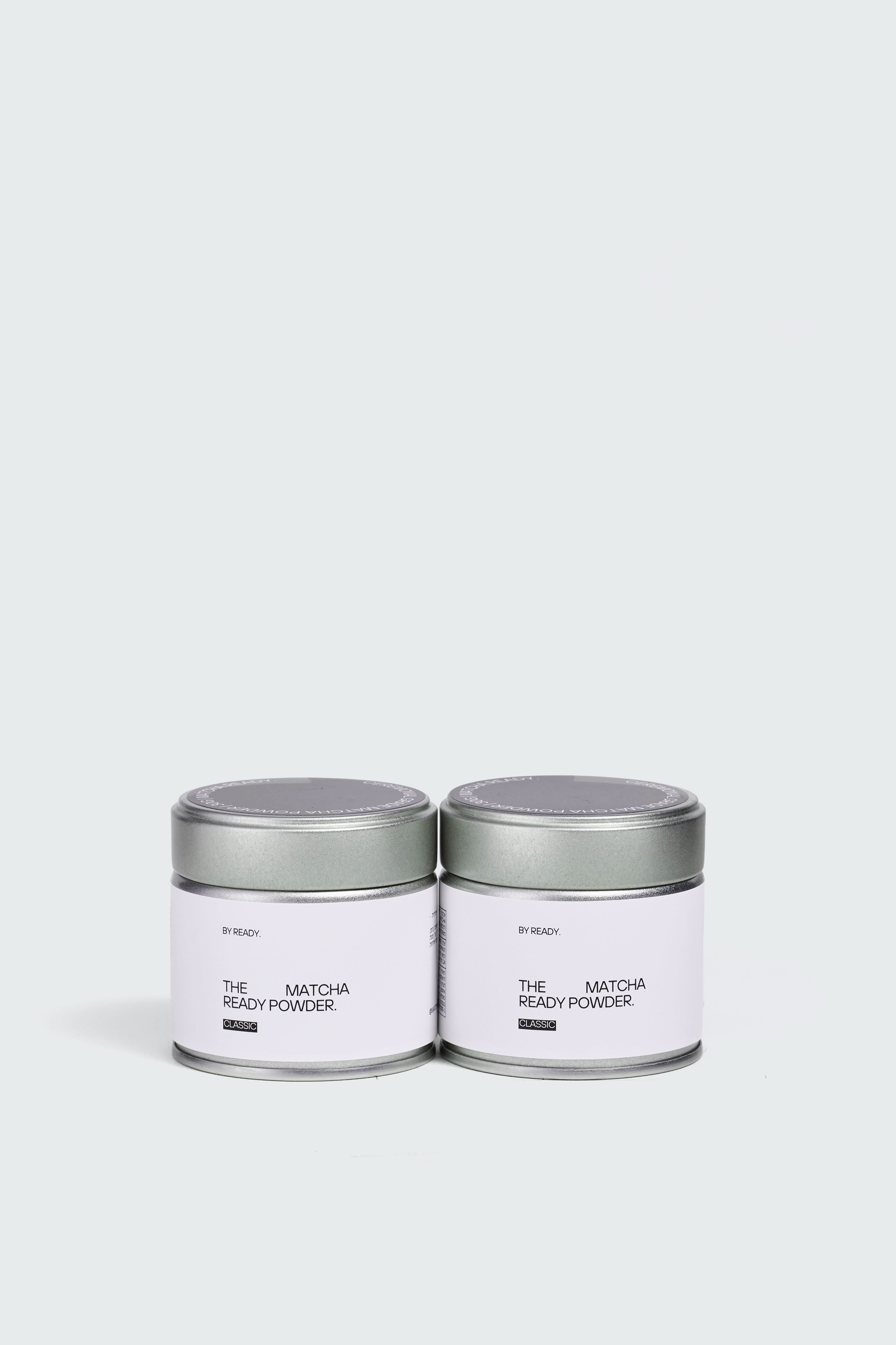 Two 30-gram Matcha Ready cans with green tea powder, shown in a close-up image.
